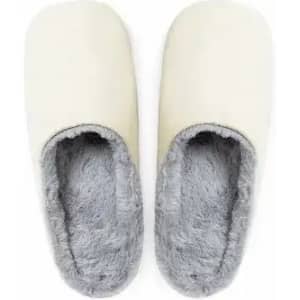 A pair of cream-coloured slippers with grey, fluffy lining, designed for comfort and warmth.