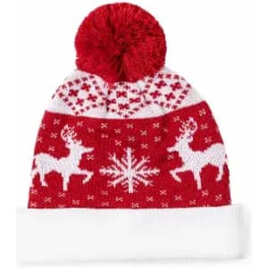 A red knitted beanie featuring white reindeer and snowflakes, topped with a red pom-pom.