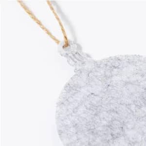 A round, textured silver promotional tag with a twine string attached.