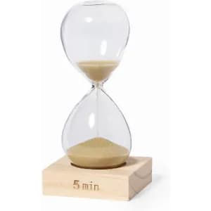 A glass hourglass with a wooden base, measuring five minutes, filled with fine sand.