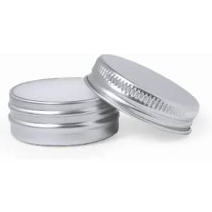A silver metal container with a smooth lid and a ribbed edge, stacked on top of another similar container.