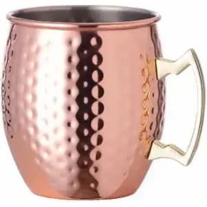 A copper mug with a hammered texture and a gold-tone handle. It has a shiny, metallic finish.