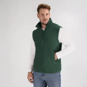 A green fleece vest featuring a high collar, worn over a long-sleeve white shirt. The vest has a zipper and no sleeves.