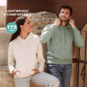 A lightweight hooded sweatshirt in green worn by a man and a cream-coloured one worn by a woman, both with a logo.
