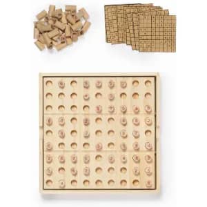 A wooden Sudoku board with numbered tiles, surrounded by score sheets. The product features a natural wood finish.