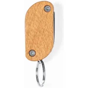 A wooden keyring in an oval shape with silver screws and a metal keyring attachment.
