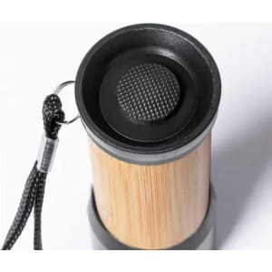 A drink bottle featuring a bamboo body and black silicone components, with a textured lid and a hanging strap.