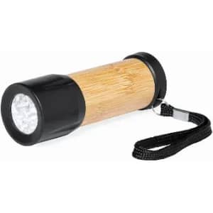 A flashlight with a bamboo barrel and black ends, featuring a wrist strap for easy carrying.