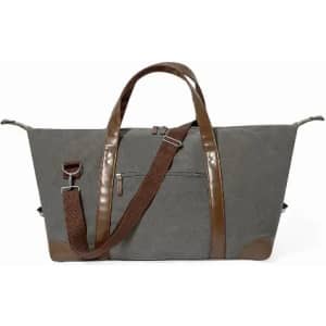 A grey bag with brown leather accents and adjustable strap, featuring a zippered pocket on the front.