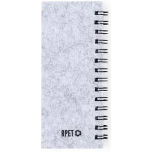 A notebook with a grey, textured cover and black spiral binding, featuring a small logo.