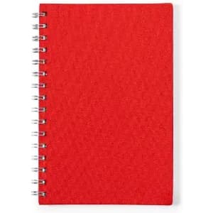 A red spiral-bound notebook with a textured cover and metallic spiral binding.