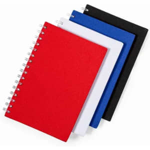 A collection of four spiral-bound notebooks in red, white, blue, and black, featuring textured covers and metal coils.