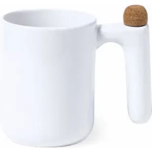 A white mug with a unique handle design and a cork accent on the top. The mug has a minimalist style.