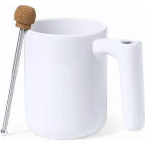 A white mug with a unique handle design and a metallic stirrer topped with a cork ball.