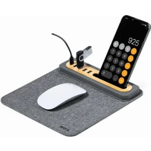 A desk mat in grey featuring a phone holder, USB ports, and a mouse. The mouse is white and sleek in design.