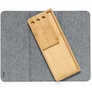 A wooden organiser tray on a grey felt surface, featuring compartments for storage.