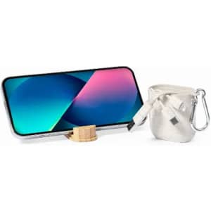 A phone stand paired with a small pouch containing charging cables, featuring a metallic and wooden design.