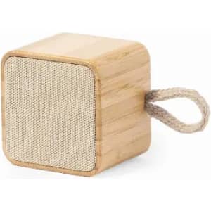 A wooden cube-shaped speaker with a textured fabric front and a rope handle.