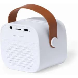 A portable speaker in white with a brown strap on top and various input options on the side.