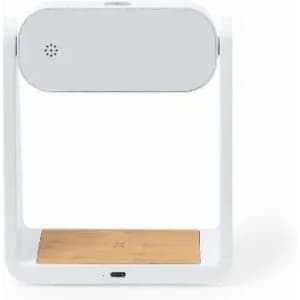 A modern white product with a wooden base, featuring a minimalist design and a small speaker grille.
