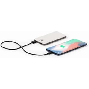 A power bank in silver connected to a smartphone with a black charging cable.
