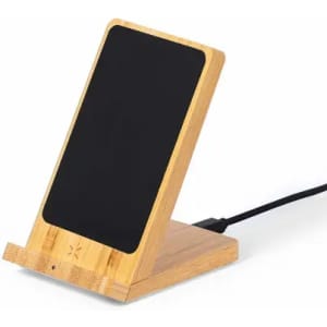 A wooden phone stand with a black surface, featuring a cable connected to its base.