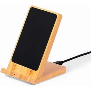 A phone stand made of bamboo with a black surface, featuring a charging cable attached.