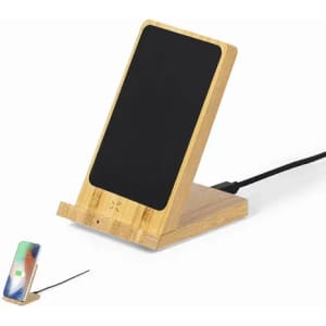 A bamboo wireless charger stand with a sleek black charging surface and a phone positioned beside it.