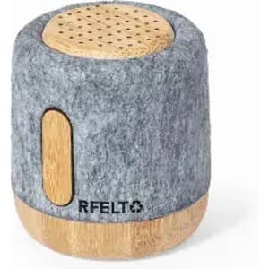 A portable speaker with a grey felt exterior and bamboo accents, featuring a logo on the front.