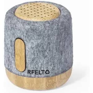 A cylindrical speaker with a grey felt exterior and bamboo accents, featuring a logo on the side.
