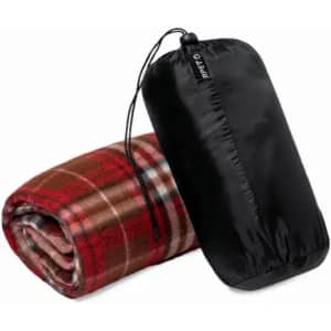 A rolled red and brown checkered blanket next to a black carrying pouch with a drawstring.