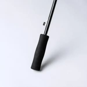 A black hiking pole with a textured grip and a metal shaft, featuring a simple, sleek design.