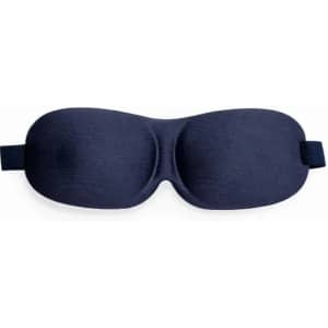 A sleep mask in navy blue, featuring a curved design and an adjustable strap.