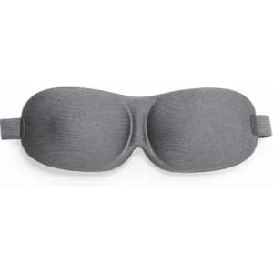 A sleep mask in a smooth grey fabric with a contoured design for comfort. It features an adjustable strap.