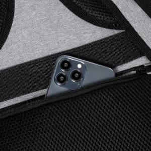 A phone with three cameras nestled in a black mesh pocket, set against a grey fabric background.