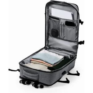 A grey suitcase, partially open, containing neatly folded clothing and various compartments inside. It features a logo.