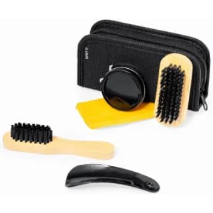 A grooming kit featuring a black brush, a wooden brush, a comb, and a cleaning cloth, all in a black pouch.