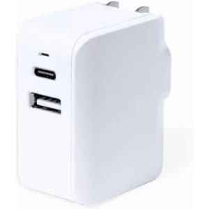 A white charging adapter with a USB-C port and a standard USB port. It has a compact design suitable for travel.