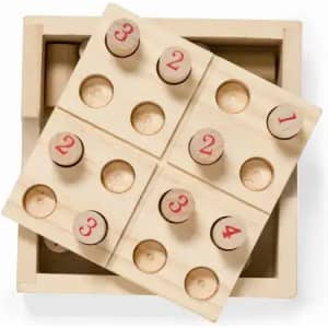A wooden number sorting game with six compartments and numbered pieces, featuring a natural wood finish.
