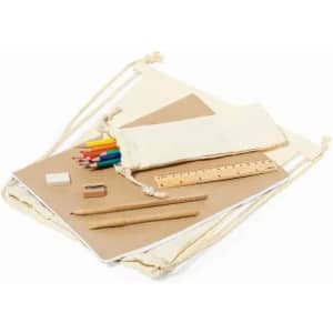 A drawstring bag containing art supplies: coloured pencils, paper, a ruler, an eraser, and wooden pencils.