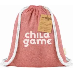 A drawstring bag in pink with white accents and a logo. Made from recycled cotton with a gift tag.