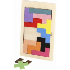 A wooden puzzle featuring various brightly coloured shapes in a rectangular frame, with two additional pieces beside it.