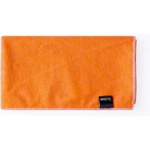 An orange microfibre cloth with a black tag. It has a textured surface and stitched edges.