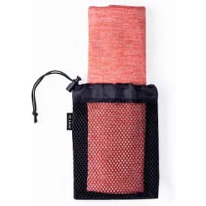 A rolled-up red towel inside a black mesh pouch, featuring a drawstring closure. The pouch has a logo.