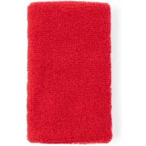 A red, fluffy towel with a textured surface, featuring a rectangular shape. It has no visible branding.