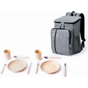 A grey backpack with a zippered compartment alongside tableware, including plates, cups, and cutlery.