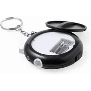 A keychain tool with a black casing, featuring compartments for small bits and a ring for attachment.