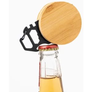 A drink bottle with a bamboo cap and a black metal opener attached, positioned on top of a glass bottle.