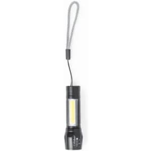 A flashlight with a black body and a handle strap, featuring a bright LED light.