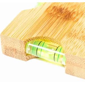 A bamboo product featuring a built-in level with green liquid and black indicators for precise measuring.